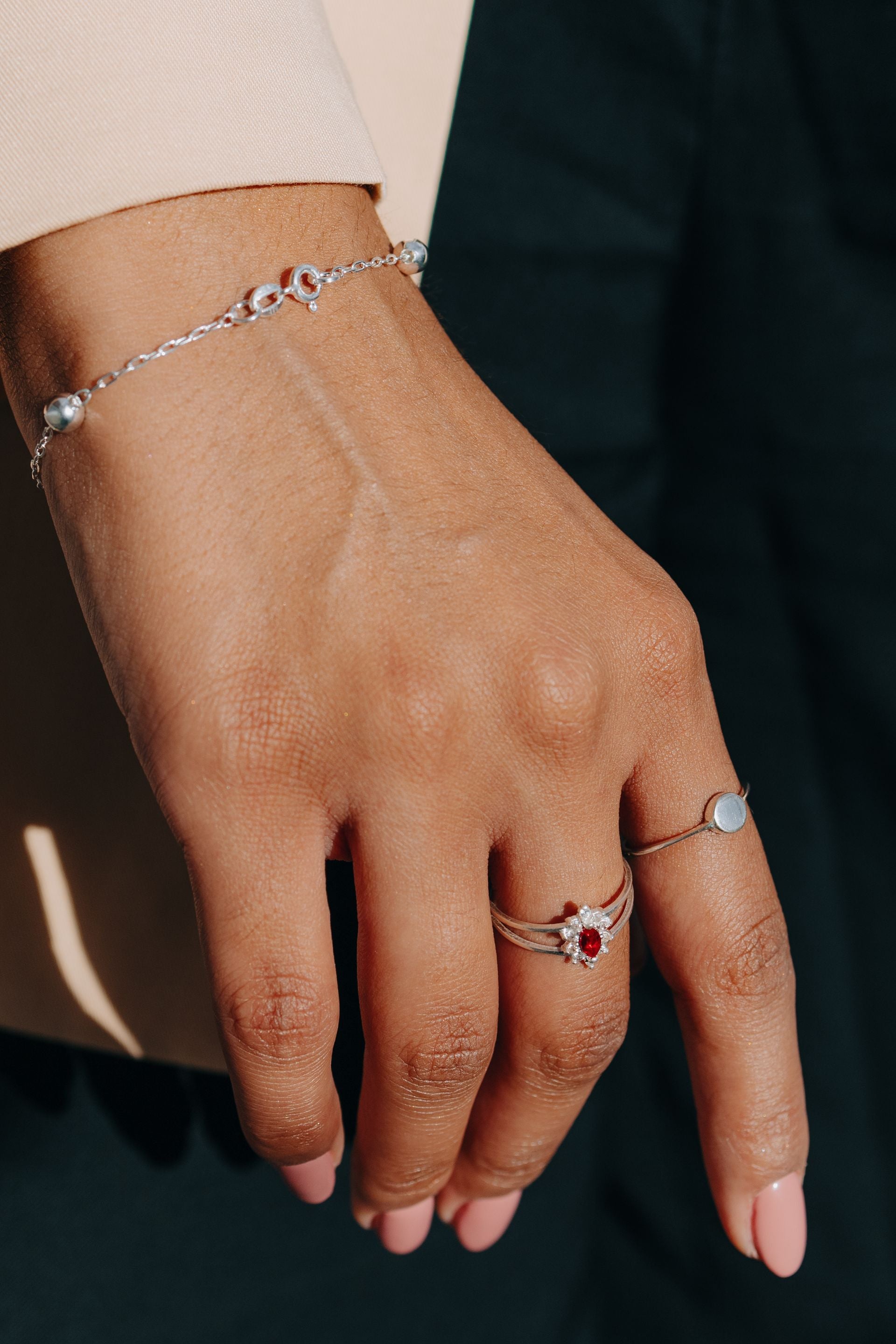 Woman hand with silver bracelet and rings - A Little Luxury Every Day